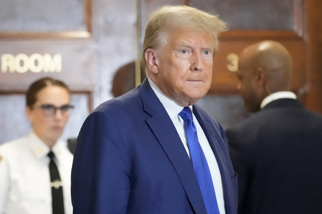 Former President Donald Trump speaks during a break in his civil business fraud trial at New York Supreme Court, Wednesday, Oct. 25, 2023, in New York. The judge in Donald Trump's civil fraud trial has fined the former president $10,000.