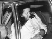 Stella Nickell, 44, is placed in the back seat of a U.S. Marshals car as she is taken from the Federal Courthouse in Seattle on Dec. 11, 1987. Nickell, accused in the cyanide poisonings of her husband and another woman, was ordered to be held without bail after a prosecutor said people shouldnt have to worry about such a crime being repeated.