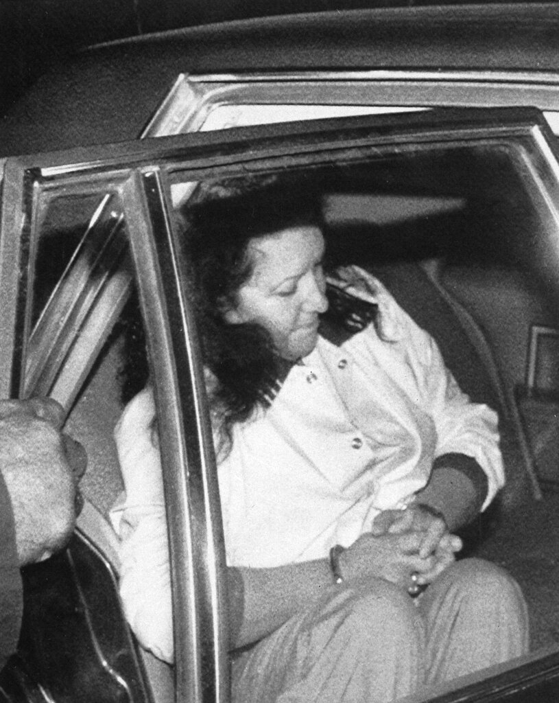 Stella Nickell, 44, is placed in the back seat of a U.S. Marshals car as she is taken from the Federal Courthouse in Seattle on Dec. 11, 1987. Nickell, accused in the cyanide poisonings of her husband and another woman, was ordered to be held without bail after a prosecutor said people shouldnt have to worry about such a crime being repeated.