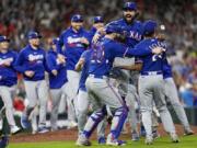 The Texas Rangers celebrate after Game 7 of the baseball AL Championship Series against the Houston Astros Monday, Oct. 23, 2023, in Houston. The Rangers won 11-4 to win the series 4-3. (AP Photo/David J.
