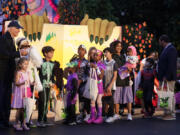 President Joe Biden poses for a photo with trick-or-treaters on the South Lawn of the White House, on Halloween, Monday, Oct. 30, 2023.