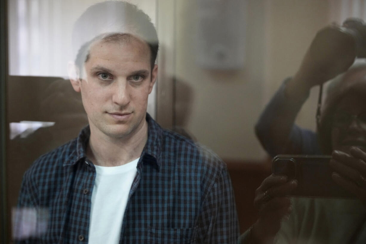 Wall Street Journal reporter Evan Gershkovich stands in a glass cage in a courtroom at the Moscow City Court, in Moscow, Russia, Tuesday, Oct. 10, 2023. A Russian court on Tuesday is scheduled to hear a defense appeal of Wall Street Journal reporter Evan Gershkovich against the decision to extend his period of detention.