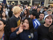 FILE - Protesters shout before a speaking engagement by Ben Shapiro on the campus of the University of California Berkeley in Berkeley, Calif., Sept. 14, 2017. New polling finds that America's college campuses are seen as far friendlier to liberals than to conservatives when it comes free speech. Polling from the University of Chicago and the AP-NORC Center for Public Affairs Research finds that 47% of adult Americans say liberals are free to express their views on college campuses, while 20% said the same of conservatives.