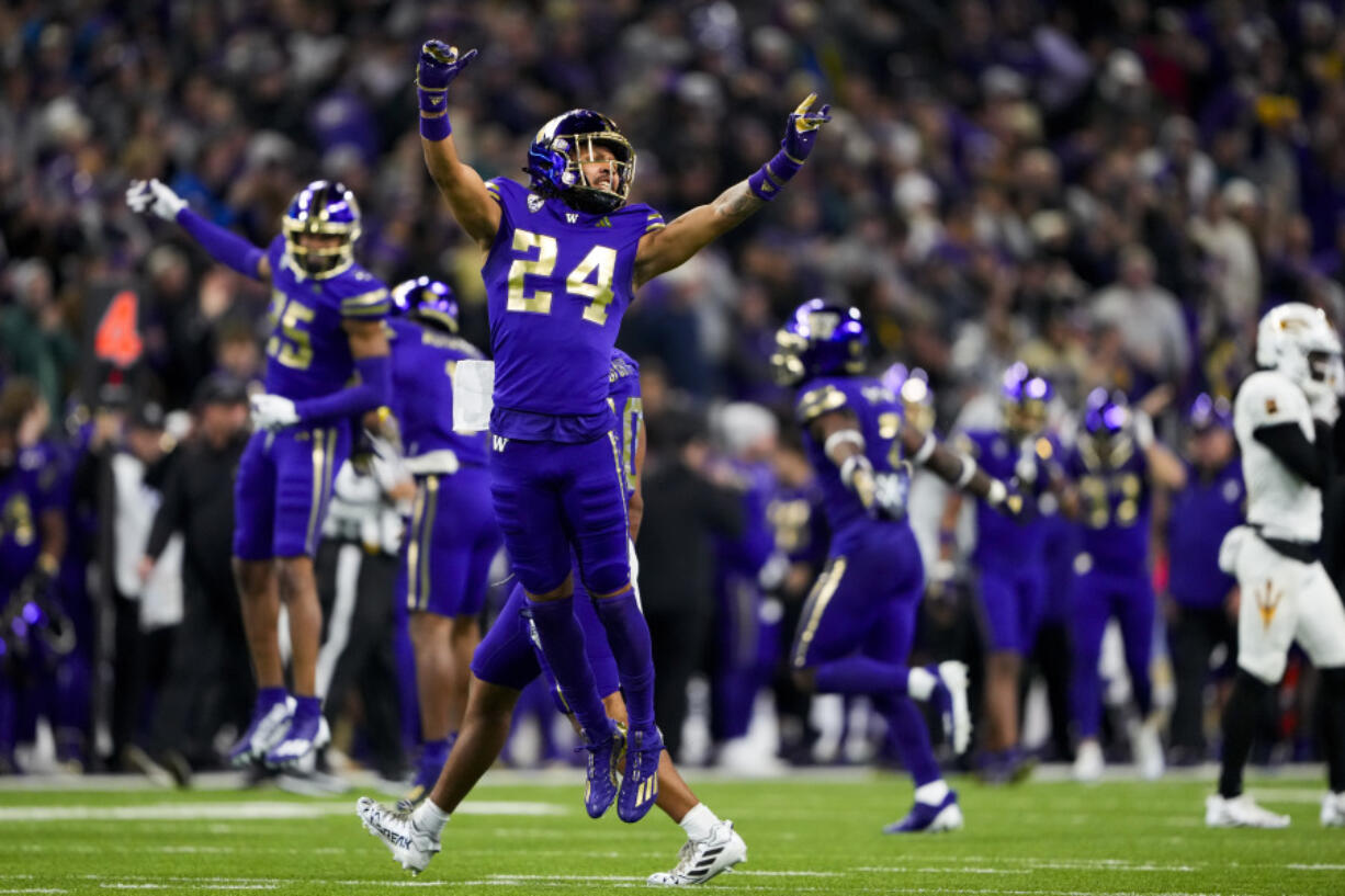 Washington safety Makell Esteen (24) reacts to a turnover on downs by Arizona State with less than a minute left in the game during the second half of an NCAA college football game Saturday, Oct. 21, 2023, in Seattle. Washington won 15-7.