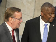 United States Secretary of Defense Lloyd Austin, right, speaks with Germany's Defense Minister Boris Pistorius during a group photo during a meeting of the North Atlantic Council in defense ministers format at NATO headquarters in Brussels, Thursday, Oct. 12, 2023.