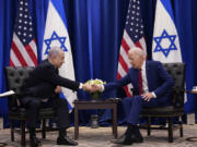 FILE - President Joe Biden meets with Israeli Prime Minister Benjamin Netanyahu in New York, Sept. 20, 2023. Less than three weeks ago, Netanyahu sat beside Biden and marveled that an "historic peace between Israel and Saudi Arabia" seemed within reach. Now, the outbreak of war between Israel and the Palestinians is threatening to delay or derail a country-by-country diplomatic push by the United States to improve relations between Israel and its Arab neighbors.