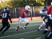 Camas running back Alex Hroza runs for yardage in the Papermakers’ 52-27 win over Union at McKenzie Stadium on Friday, Oct. 20, 2023.