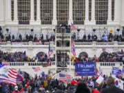 FILE - Insurrectionists loyal to President Donald Trump breach the Capitol in Washington, Jan. 6, 2021. A Proud Boys member who joined others from the far-right group in attacking the U.S. Capitol pleaded guilty on Monday, Oct. 16, 2023, to obstructing the joint session of Congress for certifying  Joe Biden's 2020 electoral victory. William Chrestman, 49, of Kansas, also pleaded guilty to threatening to assault a federal officer during the riot at the Capitol on Jan. 6, 2023.