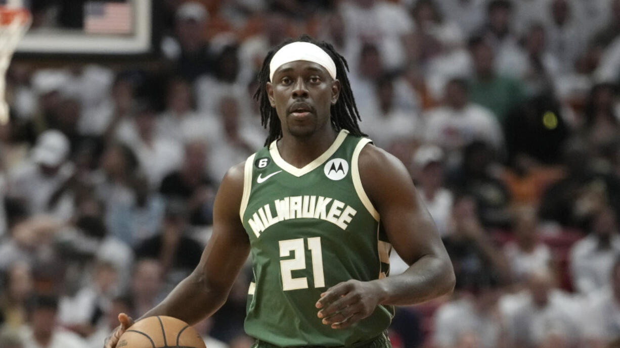 Milwaukee Bucks guard Jrue Holiday moves the ball down the court during the first half of Game 3 in a first-round NBA basketball playoff series against the Miami Heat, April 22, 2023, in Miami. Holiday is being traded to the Boston Celtics, a person with knowledge of the agreement said Sunday, Oct. 1 2023, a move that comes just four days after being sent to the Portland Trail Blazers in the deal that sent Damian Lillard to the Bucks.