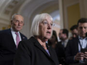 Senate Appropriations Committee Chair Patty Murray, D-Wash., joined at rear by Senate Majority Leader Chuck Schumer, D-N.Y., left, speaks to reporters following a closed-door caucus meeting, at the Capitol in Washington, Wednesday, Sept. 27, 2023. (AP Photo/J.