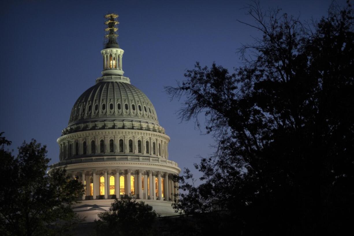 Night falls on the dome of the Capitol, hours after Rep. Kevin McCarthy, R-Calif., was ousted as Speaker of the House, Tuesday, Oct. 3, 2023 in Washington.