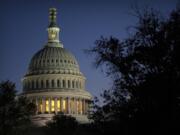 Night falls on the dome of the Capitol, hours after Rep. Kevin McCarthy, R-Calif., was ousted as Speaker of the House, Tuesday, Oct. 3, 2023 in Washington.