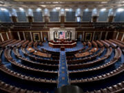 FILE - The empty chamber of the House of Representatives is seen at the Capitol in Washington, Feb. 28, 2022. Republicans have chosen congressman Mike Johnson of Louisiana as their latest nominee for House speaker. Johnson will face a floor vote Wednesday, Oct. 25, 2023, trying to unify the divided GOP majority. Johnson is the fourth candidate Republicans have nominated to replace Kevin McCarthy on Oct. 3, 2023. (AP Photo/J.