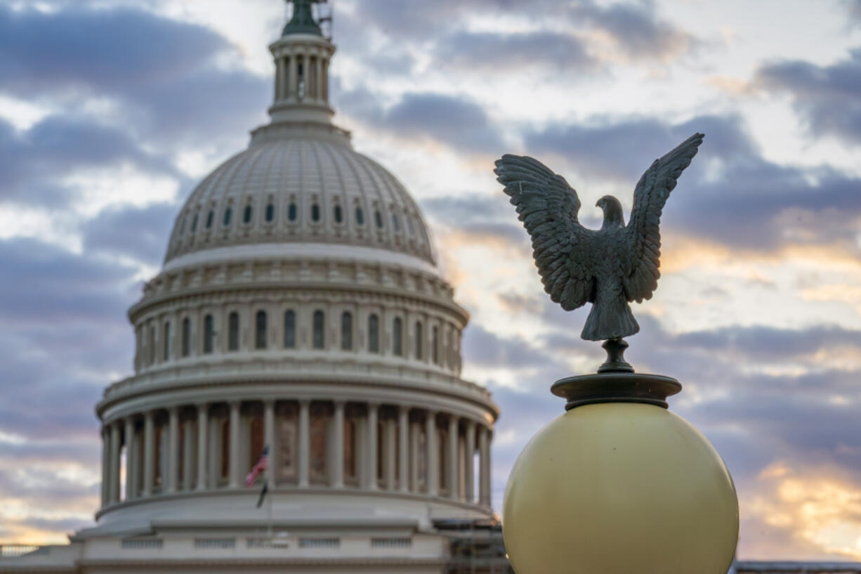 The Capitol is seen at sunrise, in Washington, Tuesday, Oct. 10, 2023. After Rep. Kevin McCarthy, R-Calif., was ousted as speaker of the House, the upheaval has put Congress at a crossroads during a moment of crisis. House business, and with it most congressional action, has come to a standstill. (AP Photo/J.