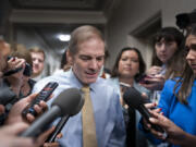 Rep. Jim Jordan, R-Ohio, chairman of the House Judiciary Committee and a staunch ally of former President Donald Trump, talks with reporters as House Republicans meet again behind closed doors to find a path to elect a new speaker after House Majority Leader Steve Scalise, R-La., dropped out of the race Thursday night, at the Capitol in Washington, Friday, Oct. 13, 2023. (AP Photo/J.