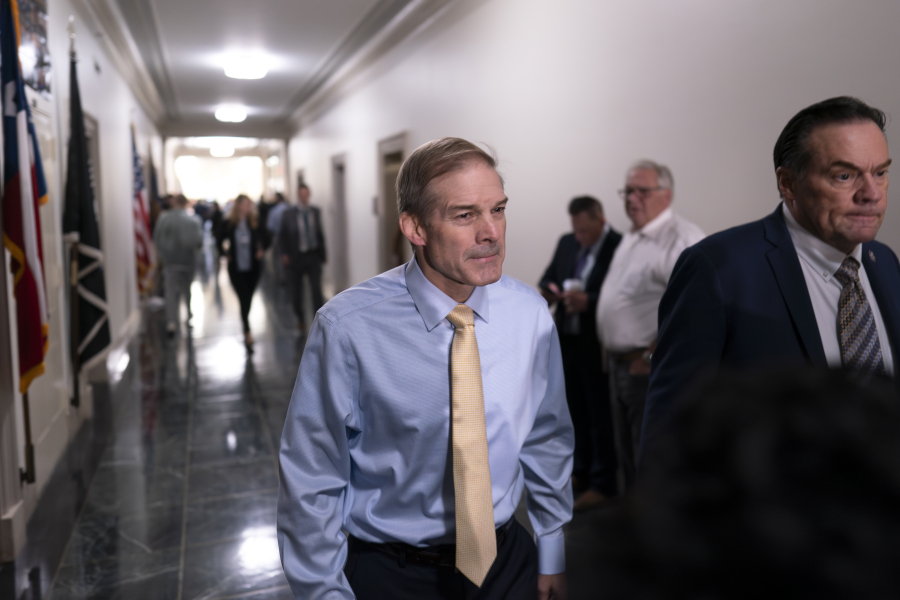 Rep. Jim Jordan, R-Ohio, center, chairman of the House Judiciary Committee and a staunch ally of former President Donald Trump, arrives as House Republicans meet again behind closed doors to work on a path to elect a new speaker after House Majority Leader Steve Scalise, R-La., dropped out of the race Thursday night, sending the GOP into further disarray, at the Capitol in Washington, Friday, Oct. 13, 2023. He is joined at right by Rep. Russ Fulcher, R-Idaho. (AP Photo/J.