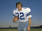 FILE - Walt Garrison, running back for the Dallas Cowboys, is shown in this 1974 photo. Walt Garrison, who led the Big 8 in rushing as an Oklahoma State Cowboy, won a Super Bowl with the Dallas Cowboys, and in the NFL offseason competed as a rodeo cowboy, has died. He was 79. The NFL team said in a story posted on its website Thursday, Oct. 12, 2023, that Garrison died overnight.