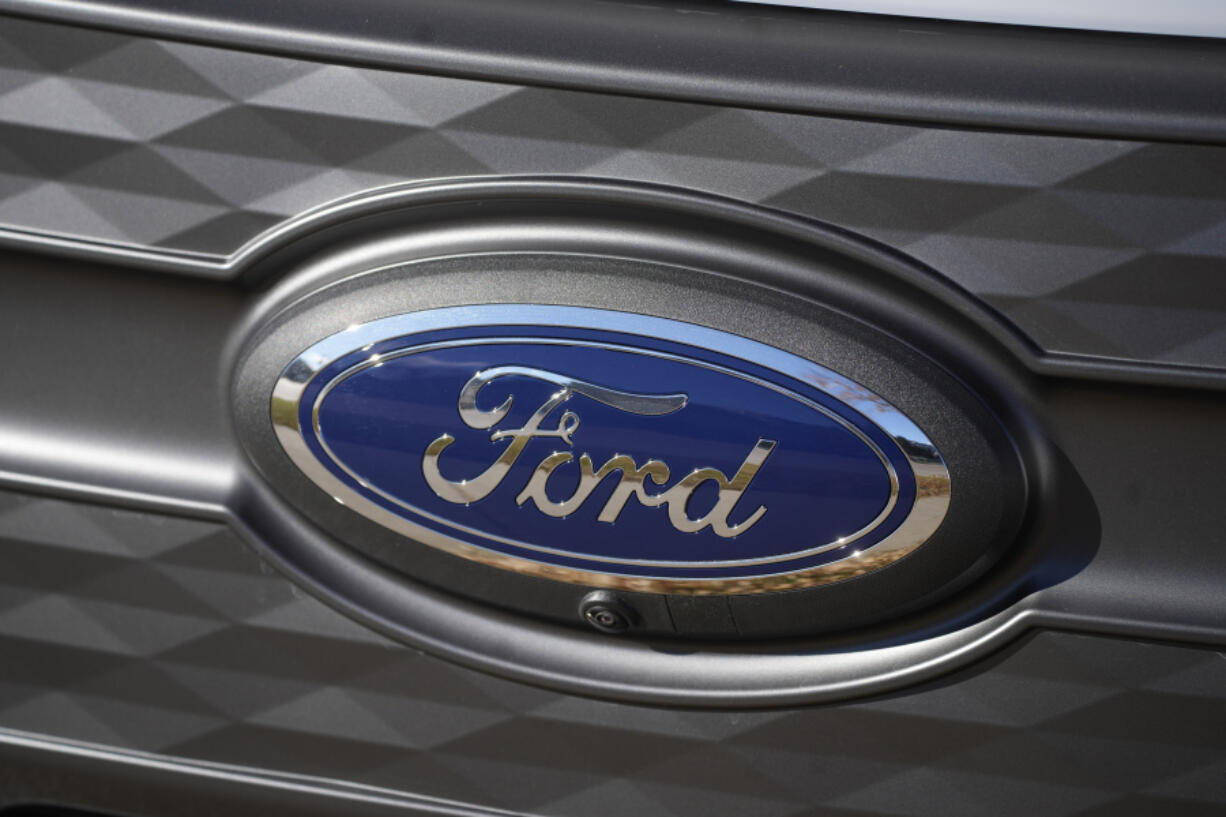 FILE - The Ford company logo is shown on Thursday, Nov. 25, 2022, outside a Ford dealership in southeast Denver.  Ford is recalling more than 238,000 Explorers in the U.S. because a rear axle bolt can fail, potentially causing a loss of drive power or allowing the SUVs to roll away while in park. The recall on Friday, Oct. 13, 2023, comes after U.S. safety regulators opened an investigation into the problem after getting two complaints that repairs didn't work in two previous recalls this year and in 2022.