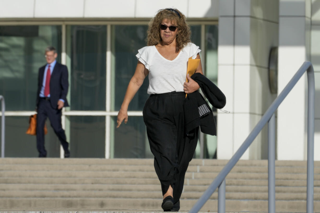 Nancy Marks leaves federal court, Thursday, Oct. 5, 2023, in Central Islip, N.Y. Marks, the ex-campaign treasurer for U.S. Rep. George Santos pleaded guilty Thursday to conspiring to defraud the U.S. government and implicated the indicted New York Republican in court with submitting bogus campaign finance reports.