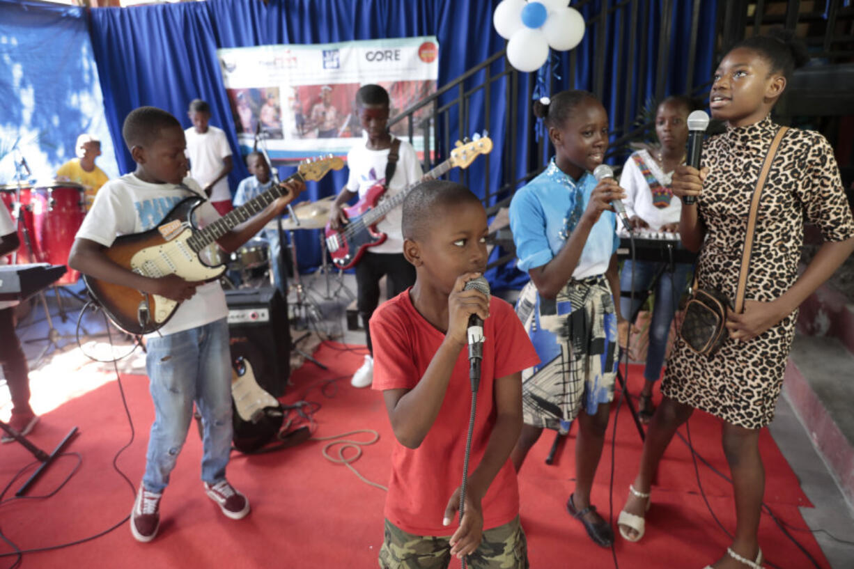 Music students practice at the Plezi Mizik Composition Futures School in Port-au-Prince, Haiti, Saturday, Sept. 23, 2023. Students in the program are allowed to choose any instrument. Available are guitars, keyboards, bass guitars, maracas, ukeleles, tambourines and cowbells.