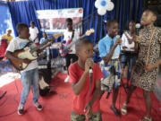 Music students practice at the Plezi Mizik Composition Futures School in Port-au-Prince, Haiti, Saturday, Sept. 23, 2023. Students in the program are allowed to choose any instrument. Available are guitars, keyboards, bass guitars, maracas, ukeleles, tambourines and cowbells.