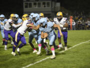 Hockinson’s Andon Stenersen (17) runs for yardage during the Hawks’ 28-7 win over Columbia River at Hockinson High School on Friday, Oct. 6, 2023.