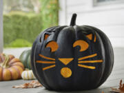 A jack-o-lantern with a feline face. Black cats, celestial imagery and ravens have a cool Halloween vibe without being scary.