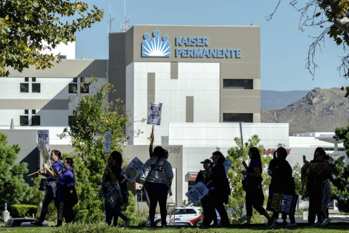 Healthcare workers picket outside Kaiser Permanente hospital during a nationwide strike, Wednesday, Oct. 4, 2023, in Moreno Valley, Calif.Some 75,000 Kaiser Permanente workers who say understaffing is hurting patient care have walked off the job in multiple states, kicking off a major health care worker strike.