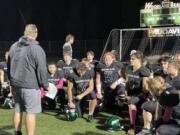 Woodland's Elijah Andersen (4) listens to head coach Sean McDonald during a post-game huddle after the Beavers' 41-10 win over Hudson's Bay on Friday, Oct. 13, 2023, at Woodland High School.