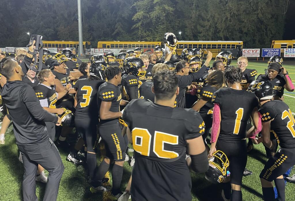 Hudson's Bay players and coaches celebrate after defeating Hockinson 21-18 on Thursday, Oct. 19, 2023, at Kiggins Bowl.