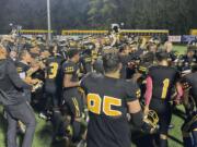 Hudson's Bay players and coaches celebrate after defeating Hockinson 21-18 on Thursday, Oct. 19, 2023, at Kiggins Bowl.