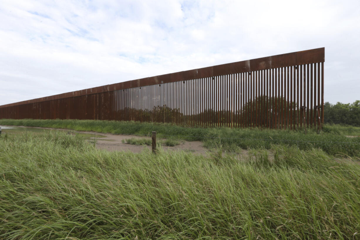 FILE - A border wall section stands on July 14, 2021, near La Grulla, Texas, in Starr County. On Wednesday, Oct. 4, 2023, the Biden administration announced that they waived 26 federal laws in South Texas to allow border wall construction, marking the administration's first use of a sweeping executive power employed often during the Trump presidency. The Department of Homeland Security posted the announcement with few details outlining the construction in Starr County, Texas.