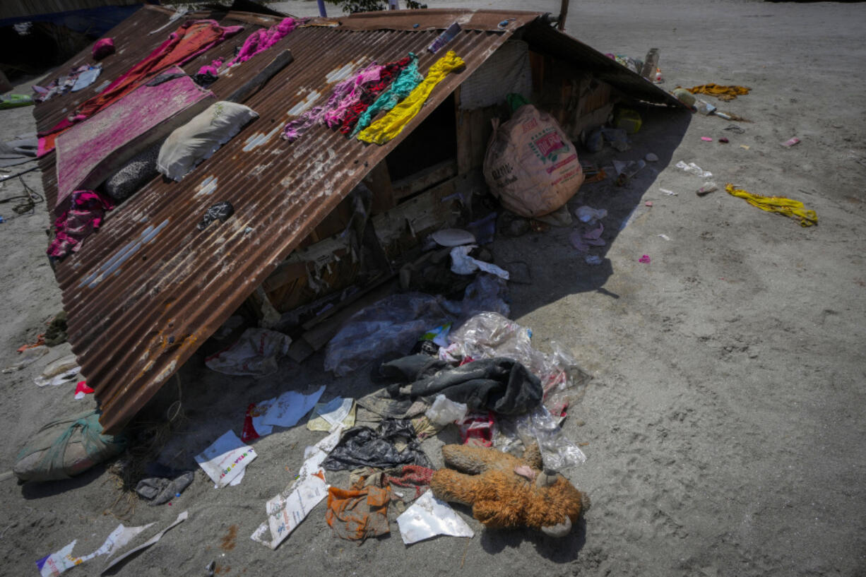 A doll lies outside a previously submerged house along the Teesta river in Rongpo, east Sikkim, India, Sunday, Oct. 8. 2023. Rescuers continued to dig through slushy debris and ice-cold water in a hunt for survivors after a glacial lake burst through a dam in India's Himalayan northeast, shortly after midnight Wednesday, washing away houses and bridges and forcing thousands to flee.