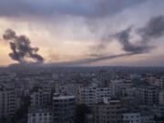 Smoke rises after the Israeli air strike in the Gaza Strip on Monday, Oct. 9, 2023. Israel's military battled to drive Hamas fighters out of southern towns and seal its borders Monday as it pounded the Gaza Strip.