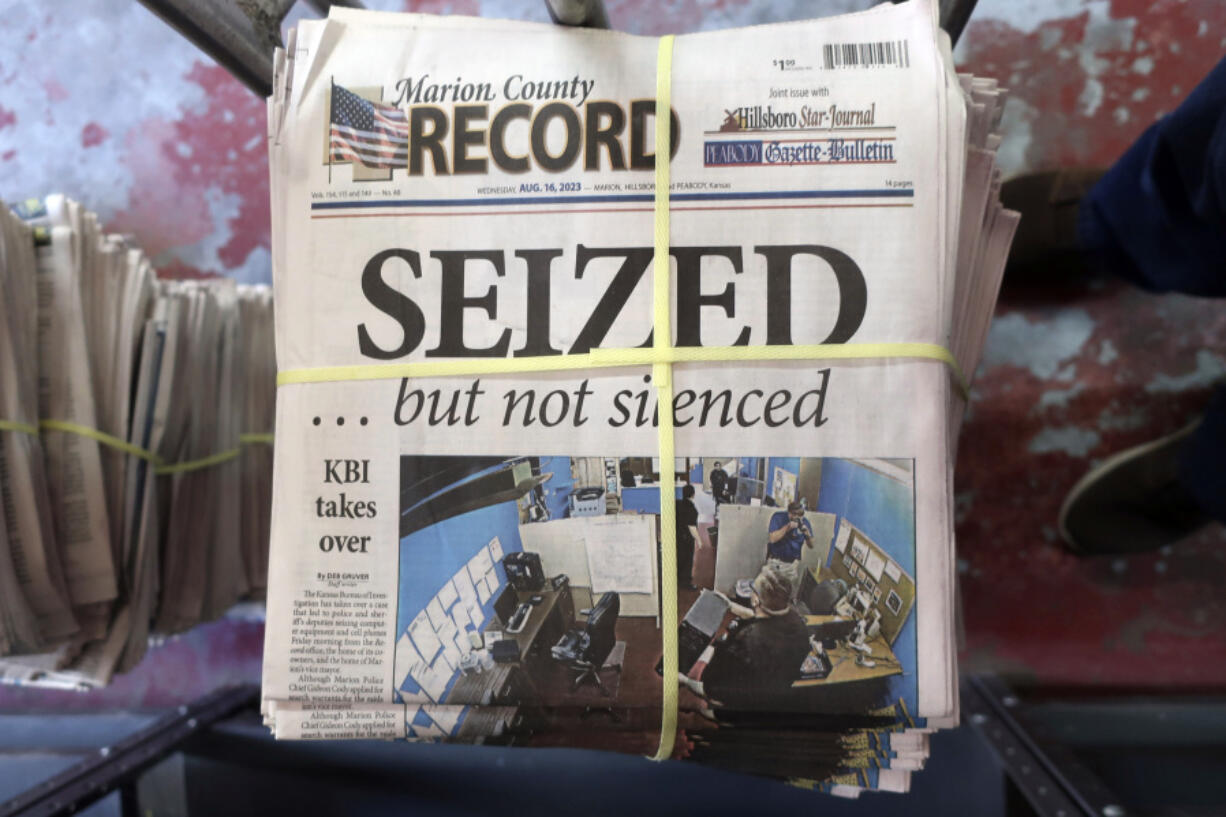 FILE - A stack of the Marion County Record sits in the back of the newspaper's building, awaiting unbundling, sorting and distribution, Aug. 16, 2023, in Marion, Kan. The police chief who led a highly criticized raid of the small Kansas newspaper is suspended, the mayor confirmed to The Associated Press on Saturday, Sept. 30. Marion Mayor Dave Mayfield in a text said he suspended Chief Gideon Cody on Thursday, Sept. 28.