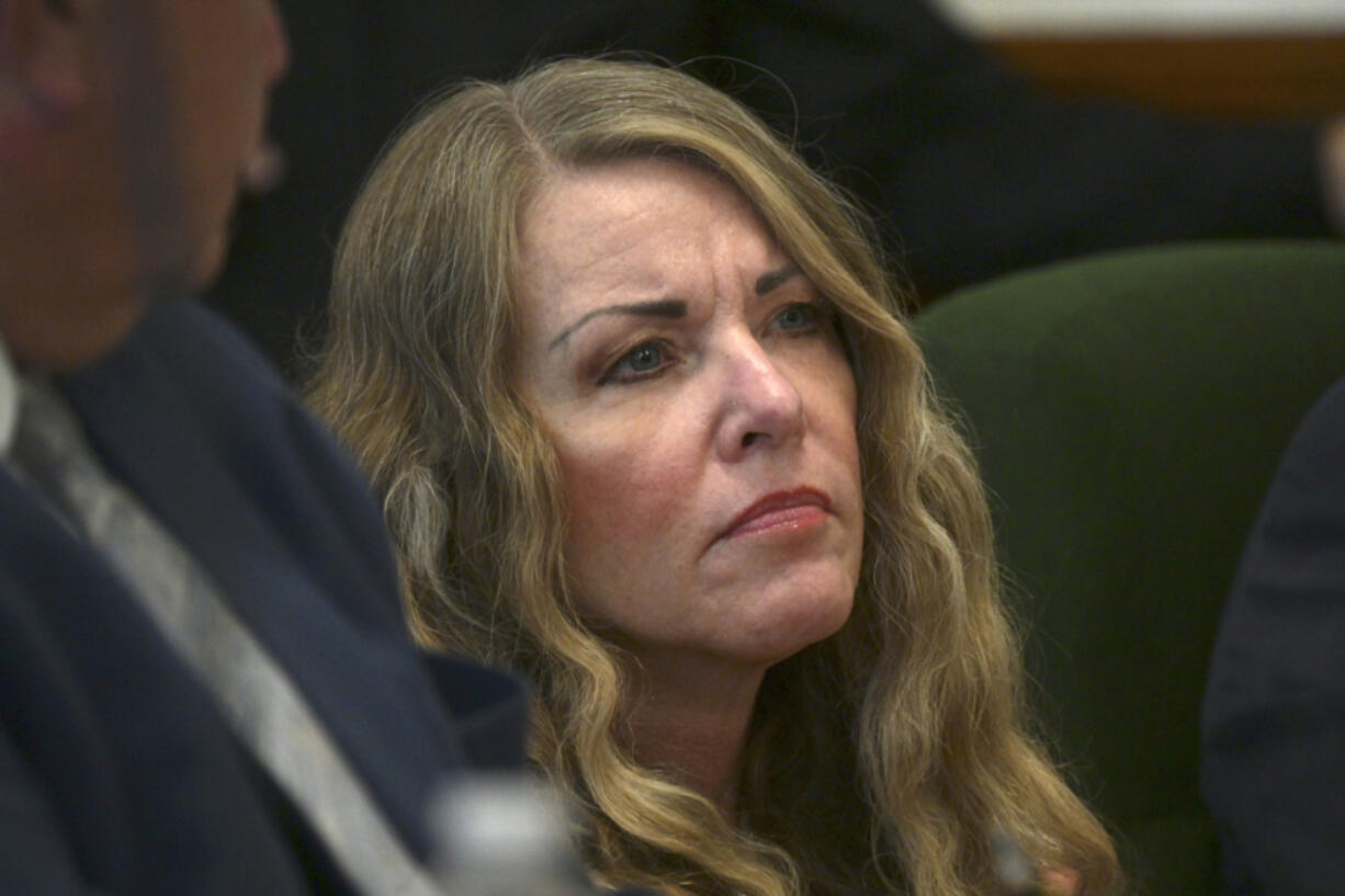 FILE - Lori Vallow Daybell sits during her sentencing hearing at the Fremont County Courthouse in St. Anthony, Idaho, July 31, 2023. On Wednesday, Oct., 25, 2023,  an extradition warrant signed by Idaho Gov. Brad Little was delivered to other state officials, allowing Arizona officials to temporarily take custody of Daybell so she can face charges of conspiring to kill her estranged husband as well as her niece's ex-husband.