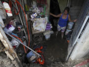 Elizabeth Morales show the damaged to her home after Hurricane Otis ripped through Acapulco, Mexico, Thursday, Oct. 26, 2023. The hurricane that strengthened swiftly before slamming into the coast early Wednesday as a Category 5 storm has killed at least 27 people as it devastated Mexico's resort city of Acapulco.