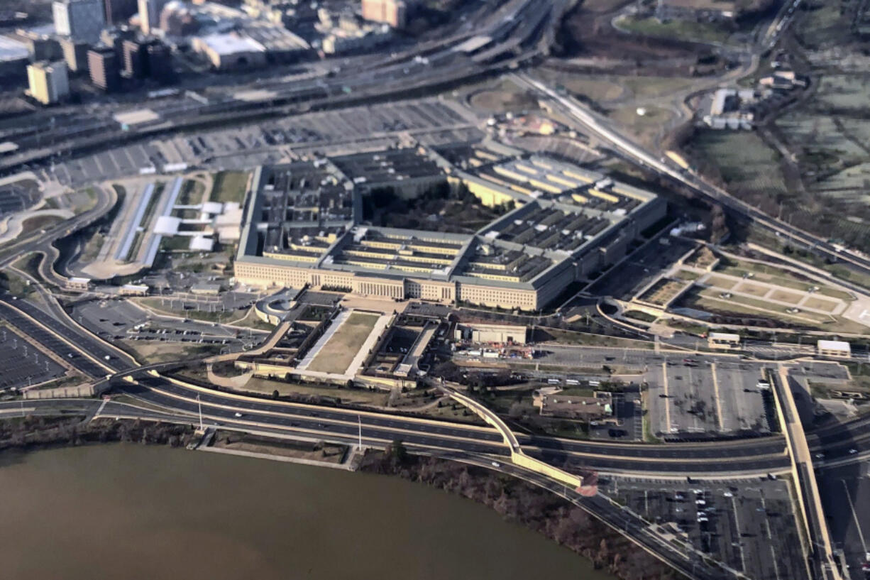 FILE - The Pentagon is seen in this aerial view made through an airplane window in Washington, Jan. 26, 2020. U.S. officials say the number of suicides in the U.S. military and their families dipped slightly in 2022, compared with the previous year.