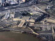 FILE - The Pentagon is seen in this aerial view made through an airplane window in Washington, Jan. 26, 2020. U.S. officials say the number of suicides in the U.S. military and their families dipped slightly in 2022, compared with the previous year.