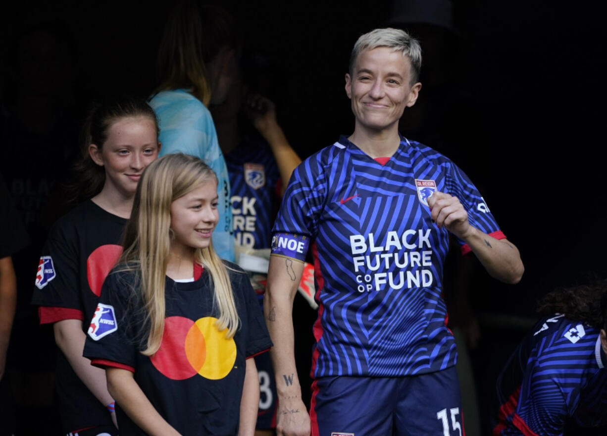 OL Reign forward Megan Rapinoe smiles before the team's NWSL soccer match against the Washington Spirit, Friday, Oct. 6, 2023, in Seattle.