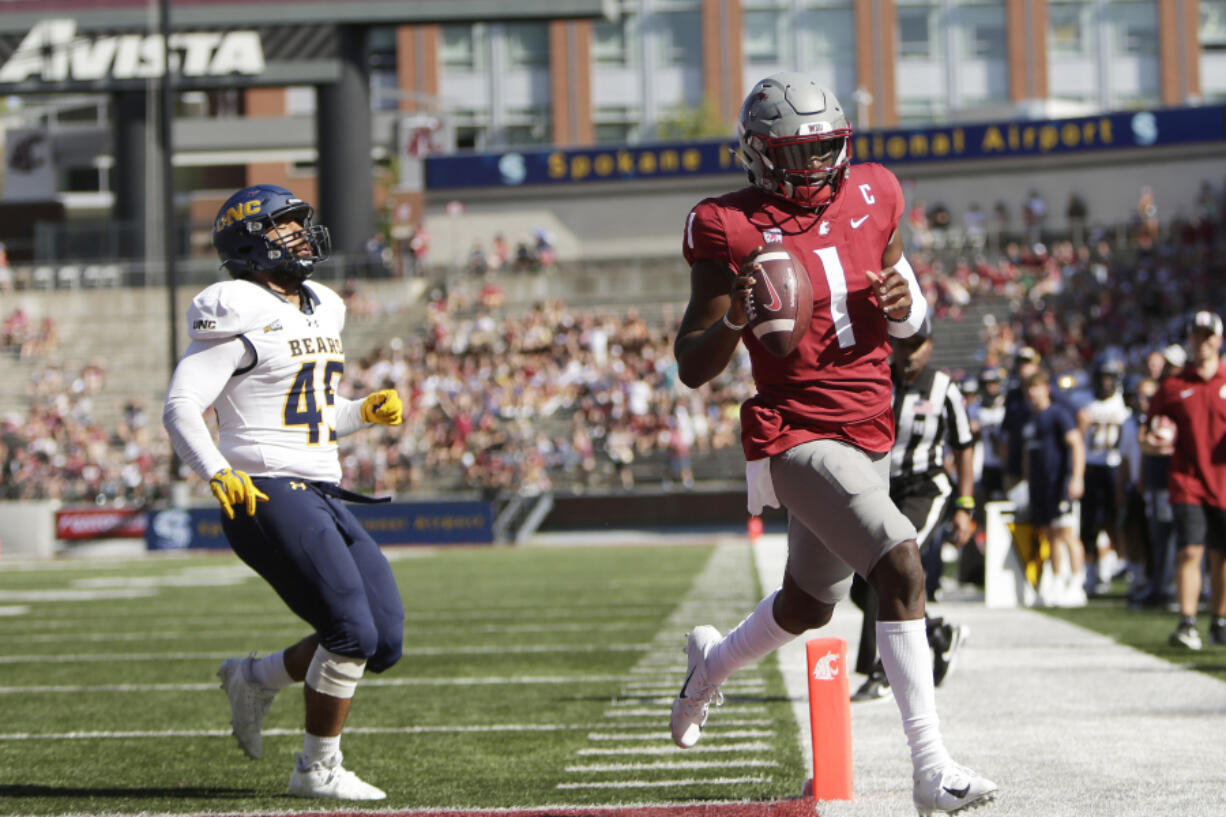 Washington State quarterback Cameron Ward (1) runs for a touchdown next to Northern Colorado linebacker Tama Tuitele during the first half of an NCAA college football game, Saturday, Sept. 16, 2023, in Pullman, Wash.