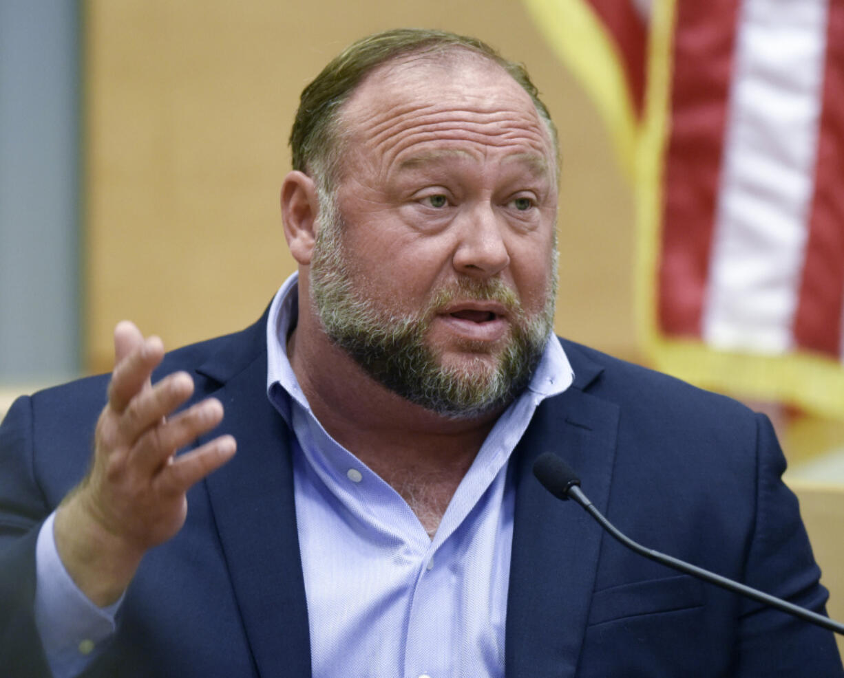 FILE - Conspiracy theorist Alex Jones takes the witness stand to testify at the Sandy Hook defamation damages trial at Connecticut Superior Court in Waterbury, Conn. Thursday, Sept. 22, 2022. A bank recently shut down the accounts of Jones' media company citing unauthorized transactions -- a move that caused panic at the business when its balances suddenly dropped from more than $2 million to zero, according to a bankruptcy lawyer for the company.