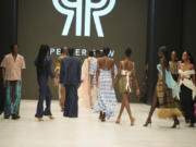 Models wear a creation by Pepper Row during the Lagos Fashion Week in Lagos, Nigeria, Thursday, Oct. 26, 2023. Africa's fashion industry is rapidly growing to meet local and international demands but a lack of adequate investment still limits its full potential, UNESCO said Thursday in its new report released at this year's Lagos Fashion Week show.