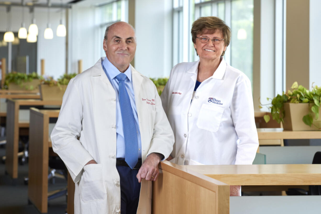 In this undated image provided by Penn Medicine, Katalin Karik? and Drew Weissman pose for a photo at the University of Pennsylvania in Philadelphia. Karik? and Weissman won the Nobel Prize in medicine on Monday, Oct. 2, 2023, for discoveries that enabled the creation of mRNA vaccines against COVID-19 and that could be used to develop other shots in the future.