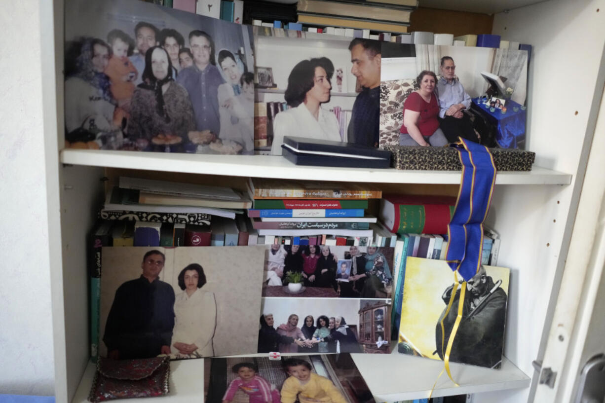 Family pictures are seen at the apartment of Narges Mohammadi's husband Taghi Rahmani Friday, Oct. 6, 2023 in Paris. Imprisoned Iranian activist Narges Mohammadi won the Nobel Peace Prize on Friday in recognition of her tireless campaigning for women's rights and democracy and against the death penalty.