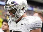 Oregon quarterback Bo Nix walks to the locker room after the first half of an NCAA college football game against Washington, Saturday, Oct. 14, 2023, in Seattle.