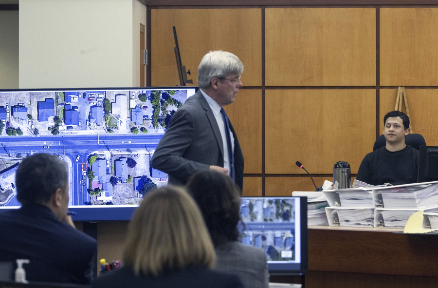 Defense attorney Wayne Fricke, center, cross examines Seth Cowden, a witness who filmed video of the beating and killing of Manny Ellis, in Pierce County Superior Court Wednesday, Oct. 18, 2023, in Tacoma, Wash. Tacoma Police Officers Christopher Burbank, Matthew Collins and Timothy Rankine are on trial for the killing of Manny Ellis on March 3, 2020.. (Ellen M.