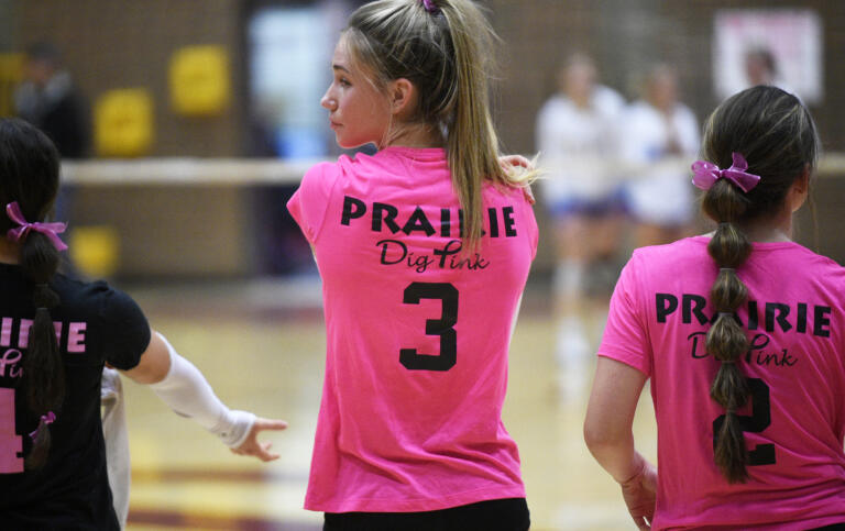 Prairie senior Ali Millspaugh (3) stands with her teammates during a Pink Night volleyball match against Kelso at Prairie High School on Oct. 9, 2023.