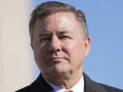 FILE - Oklahoma Attorney General Gentner Drummond stands during the playing of the national anthem at the inauguration ceremonies, Jan. 9, 2023, in Oklahoma City. Oklahoma's Republican Attorney General Gentner Drummond on Friday, Oct. 20, 2023, sued to stop a state board from establishing and funding what would be the nation's first religious public charter school after the board ignored Drummond's warning that it would violate both the state and U.S. constitutions.