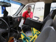 Deneshun Graves, a disease intervention specialist with the Houston Health Department, gets her paperwork organized in the cab of her pickup truck before heading out to meet with clients in Houston on Thursday, Oct. 26, 2023. The Houston Health Department is in the midst of what it calls a "rapid community outreach response" because of syphilis cases increased by 128% among women from 2019 to 2022, and congenital syphilis cases went from 16 in 2019 to 151 in 2021.